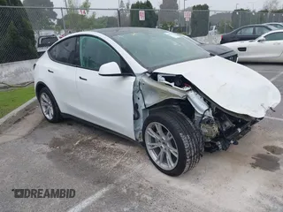 2022 Tesla Model Y Long Range with VIN 7SAYGDEE4NF315356, listed as a IAAI auction lot 41571151 with 1,056 mi miles and . Bid and sale history available at carsss.com. Image 1.