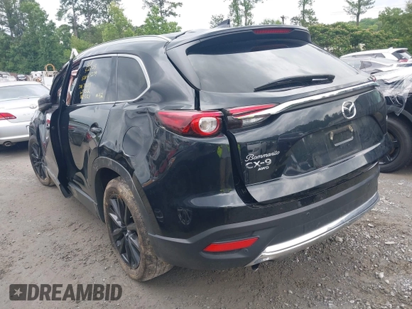 2022 Mazda CX-9 Touring Plus z VIN JM3TCBAY2N0619279, wystawiony jako IAAI lot #42373722 z przebiegiem 43 540 mil mil oraz . Historia ofert i sprzedaży dostępna na DreamBid. Obrazek 3.