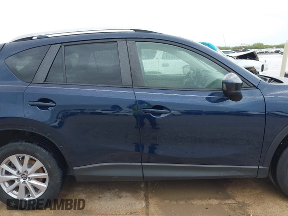 2015 Mazda CX-5 Touring with VIN JM3KE2CY5F0449195, listed as a IAAI auction lot 41894567 with 124,694 mi miles and . Bid and sale history available at DreamBid. Image 13.