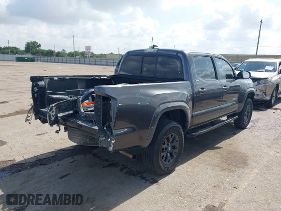 2021 Toyota Tacoma SR with VIN 3TYAX5GNXMT012484, listed as a IAAI auction lot 42429068 with 105,555 mi miles and . Bid and sale history available at DreamBid. Image 4.