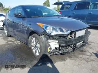2016 Hyundai Veloster z VIN KMHTC6AD1GU286674, wystawiony jako IAAI lot #41627128 z przebiegiem 71 617 mil mil oraz . Historia ofert i sprzedaży dostępna na DreamBid. Obrazek 1.