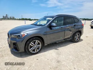 2021 BMW X1 xDrive28i with VIN WBXJG9C08M5T12191, listed as a Copart auction lot 60115585 with 18,806 mi miles and Salvage title. Bid and sale history available at DreamBid. Image 1.