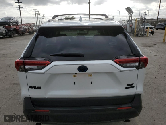 2024 Toyota RAV4 Hybrid XLE Premium with VIN JTMB6RFV3RJ059534, listed as a Copart auction lot 54611825 with 6,319 mi miles and Salvage Title. Bid and sale history available at carsss.com. Image 6.