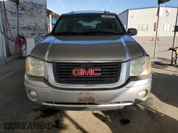 2005 GMC Envoy SLE with VIN 1GKDS13S852374516, listed as a Copart auction lot 42409725 with 299,816 mi miles and Salvage Title. Bid and sale history available at carsss.com. Image 5.