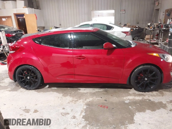 2012 Hyundai Veloster w/Black Int z VIN KMHTC6AD8CU032759, wystawiony jako IAAI lot #41567265 z przebiegiem 156 973 mil mil oraz . Historia ofert i sprzedaży dostępna na DreamBid. Obrazek 13.