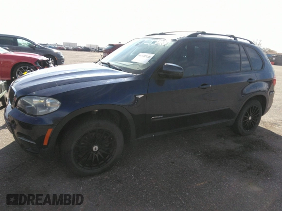 2012 BMW X5 35i с VIN 5UXZV4C5XCL749123, выставлен на аукционе IAAI как лот 41749728 с пробегом 124 193 миль миль и . История ставок и продаж доступна на DreamBid. Изображение 14.
