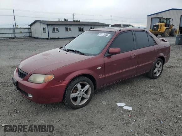 2002 Mazda Protege DX z VIN JM1BJ225320636991, wystawiony jako Copart lot #57915265 z przebiegiem 123 371 mil mil oraz Szkoda całkowita • Salvage title. Historia ofert i sprzedaży dostępna na DreamBid. Obrazek 1.