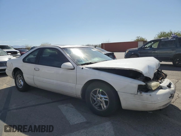 1996 Ford Thunderbird LX z VIN 1FALP62W7TH119284, wystawiony jako Copart lot #71701084 z przebiegiem 239 462 mil mil oraz Szkoda całkowita • Salvage title. Historia ofert i sprzedaży dostępna na DreamBid. Obrazek 4.