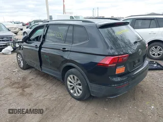 2018 Volkswagen Tiguan S with VIN 3VV1B7AX1JM076071, listed as a IAAI auction lot 42043311 with 107,883 mi miles and . Bid and sale history available at DreamBid. Image 3.