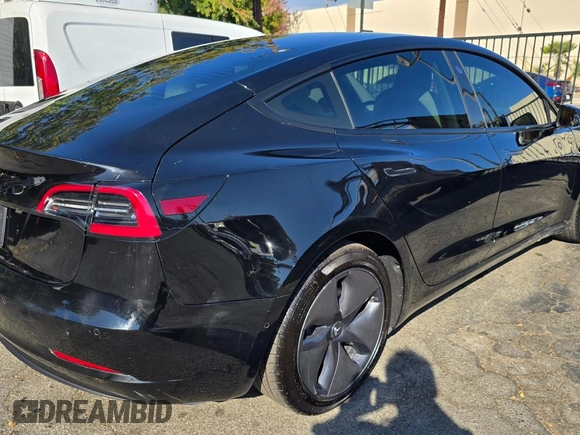 2021 Tesla Model 3 Standard Range Plus with VIN 5YJ3E1EA1MF871146, listed as a Copart auction lot 74850124 with 72,492 mi miles and Salvage Title. Bid and sale history available at DreamBid. Image 4.