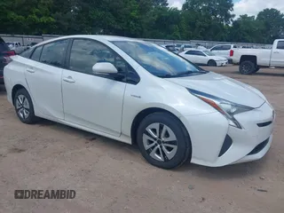 2017 Toyota Prius Two with VIN JTDKARFUXH3040780, listed as a IAAI auction lot 42091493 with 105,952 mi miles and . Bid and sale history available at DreamBid. Image 1.