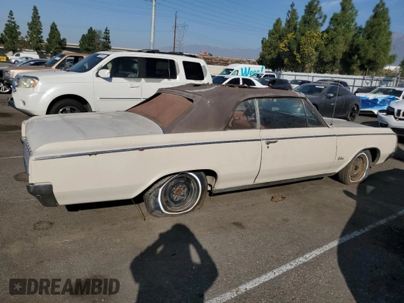 1964 Oldsmobile Cutlass with VIN 824F023233, listed as a Copart auction lot 75574234 with 90,534 mi miles and Clean Title. Bid and sale history available at DreamBid. Image 3.