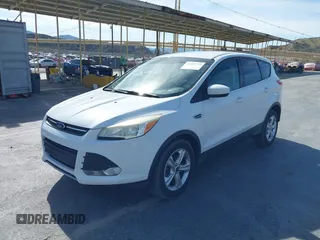 2014 Ford Escape SE with VIN 1FMCU9GX0EUD05633, listed as a IAAI auction lot 41582757 with 103,729 mi miles. Bid and sale history available at carsss.com. Image 2.