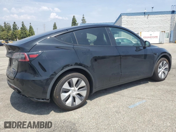 2024 Tesla Model Y Long Range with VIN 7SAYGDEE4RA228916, listed as a Copart auction lot 54921575 with 13,607 mi miles and Salvage title. Bid and sale history available at DreamBid. Image 3.