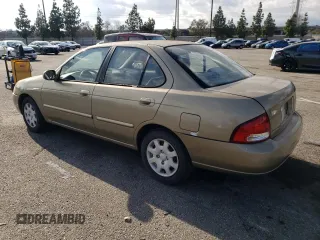 2000 Nissan Sentra XE with VIN 3N1CB51D3YL311011, listed as a Copart auction lot 71841274 with 146,760 mi miles and Salvage title. Bid and sale history available at DreamBid. Image 2.