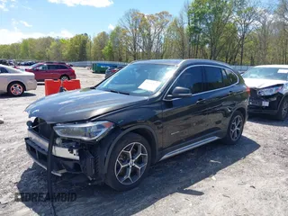 2016 BMW X1 xDrive28i with VIN WBXHT3C3XGP889833, listed as a IAAI auction lot 39118131 with 111,343 mi miles. Bid and sale history available at carsss.com. Image 2.