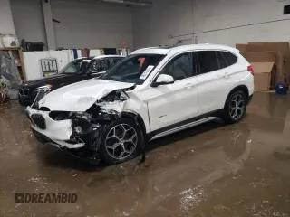 2016 BMW X1 xDrive28i with VIN WBXHT3C3XG5E51117, listed as a Copart auction lot 48243355 with 129,607 mi miles and Salvage Title. Bid and sale history available at carsss.com. Image 1.