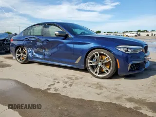 2020 BMW 5 Series M550i xDrive with VIN WBAJS7C09LCE06865, listed as a Copart auction lot 60140955 with Not provided miles and Salvage title. Bid and sale history available at DreamBid. Image 4.