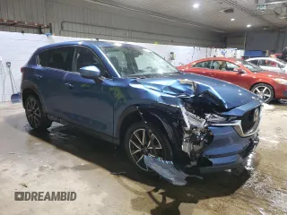 2018 Mazda CX-5 Grand Touring with VIN JM3KFBDM1J0304706, listed as a Copart auction lot 46123415 with 104,004 mi miles and Salvage title. Bid and sale history available at DreamBid. Image 4.