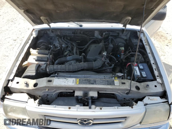 2002 Mazda B-Series Truck DS z VIN 4F4YR16U72TM03068, wystawiony jako Copart lot #55536395 z przebiegiem 199 895 mil mil oraz Czysty tytuł • Clean title. Historia ofert i sprzedaży dostępna na DreamBid. Obrazek 11.