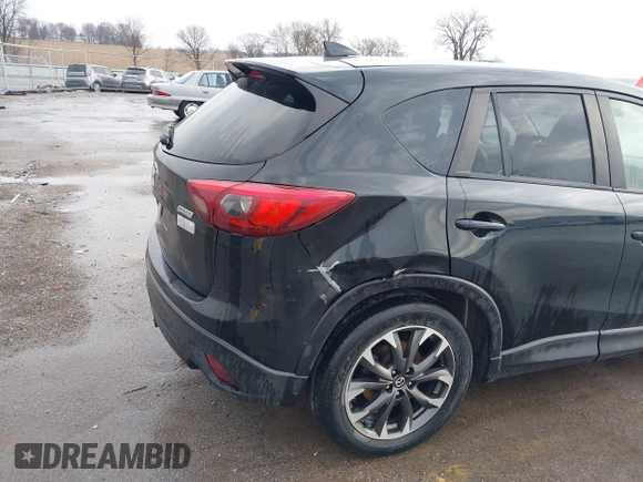 2016 Mazda CX-5 Grand Touring with VIN JM3KE4DY3G0769448, listed as a IAAI auction lot 41947725 with 154,051 mi miles and . Bid and sale history available at carsss.com. Image 18.
