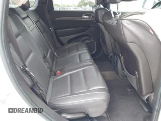 2014 Jeep Grand Cherokee Summit z VIN 1C4RJEJG1EC357948, wystawiony jako IAAI lot #42498652 z przebiegiem 213 715 mil mil oraz . Historia ofert i sprzedaży dostępna na DreamBid. Obrazek 8.