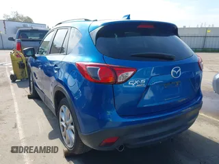 2014 Mazda CX-5 Grand Touring with VIN JM3KE4DY1E0327703, listed as a IAAI auction lot 41755735 with 206,845 mi miles. Bid and sale history available at carsss.com. Image 3.