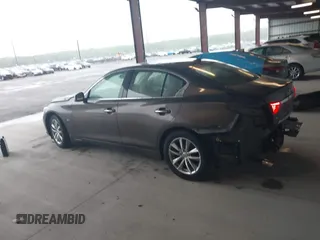 2015 Infiniti Q50 Premium z VIN JN1BV7AR0FM393387, wystawiony jako IAAI lot #42257850 z przebiegiem 176 436 mil mil oraz . Historia ofert i sprzedaży dostępna na DreamBid. Obrazek 14.