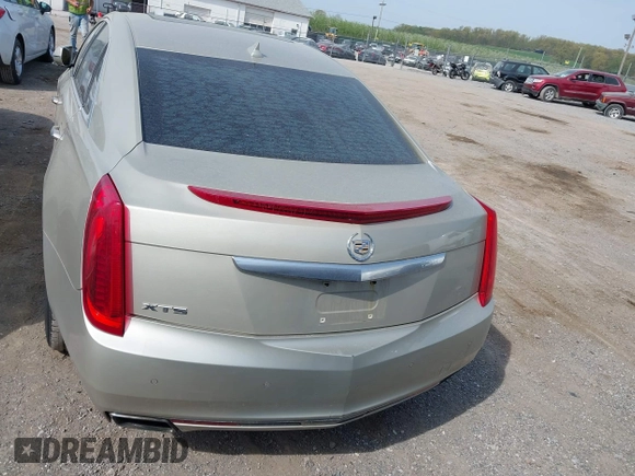 2013 Cadillac XTS Premium z VIN 2G61S5S35D9143656, wystawiony jako IAAI lot #42099511 z przebiegiem 207 055 mil mil oraz . Historia ofert i sprzedaży dostępna na DreamBid. Obrazek 16.
