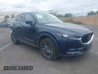 2021 Mazda CX-5 Touring with VIN JM3KFACM9M0410031, listed as a IAAI auction lot 41949116 with 34,907 mi miles. Bid and sale history available at carsss.com. Image 1.
