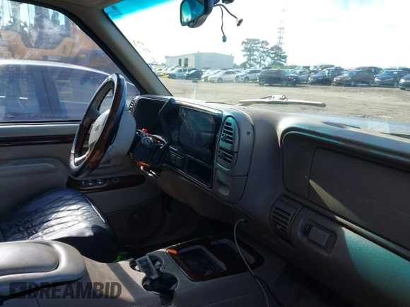 1999 Cadillac Escalade z VIN 1GYEK13R4XR411823, wystawiony jako IAAI lot #41221246 z przebiegiem 184 123 mil mil oraz . Historia ofert i sprzedaży dostępna na DreamBid. Obrazek 5.