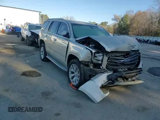 2015 GMC Yukon SLE with VIN 1GKS1AKC4FR265208, listed as a Copart auction lot 42324245 with 105,760 mi miles and Salvage Title. Bid and sale history available at carsss.com. Image 14.