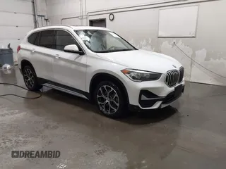 2021 BMW X1 xDrive28i with VIN WBXJG9C03M5T23289, listed as a IAAI auction lot 41603974 with 60,798 mi miles. Bid and sale history available at carsss.com. Image 1.