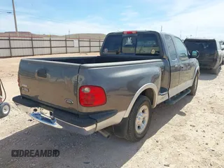 2002 Ford F-150 XL with VIN 1FTRX07L92KC81256, listed as a IAAI auction lot 41765831 with 149,506 mi miles. Bid and sale history available at carsss.com. Image 4.
