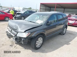 2015 Dodge Journey American Value Pkg with VIN 3C4PDCAB2FT641361, listed as a IAAI auction lot 40299991 with 202,003 mi miles. Bid and sale history available at carsss.com. Image 2.