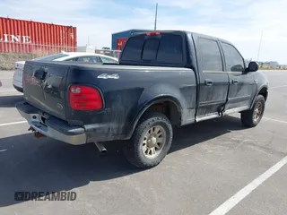 2003 Ford F-150 XLT with VIN 1FTRW08L83KA14760, listed as a IAAI auction lot 41820943 with 215,130 mi miles. Bid and sale history available at carsss.com. Image 4.