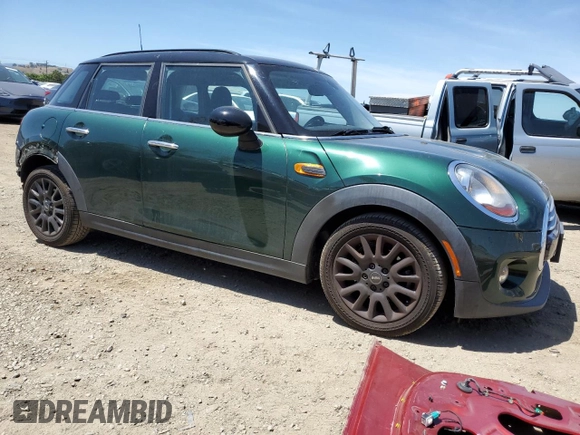 2015 MINI Hardtop 4 Door with VIN WMWXS5C56FT830564, listed as a Copart auction lot 55784695 with 52,089 mi miles and Salvage Title. Bid and sale history available at DreamBid. Image 4.