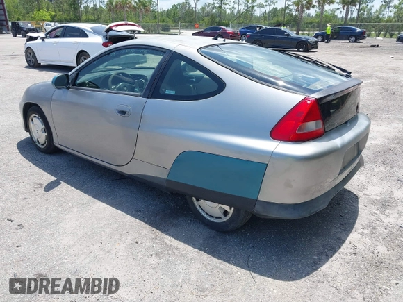 2004 Honda Insight z VIN JHMZE14744T000527, wystawiony jako IAAI lot #42378630 z przebiegiem 1 360 mil mil oraz . Historia ofert i sprzedaży dostępna na DreamBid. Obrazek 3.