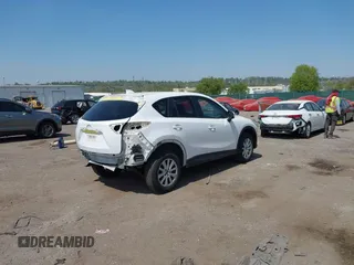 2013 Mazda CX-5 Touring with VIN JM3KE4CE1D0136241, listed as a IAAI auction lot 42119260 with 106,913 mi miles and . Bid and sale history available at carsss.com. Image 4.