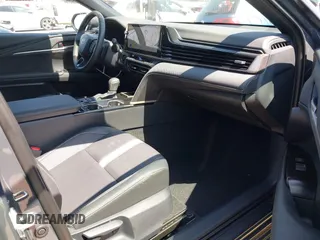 2025 Toyota Camry LE z VIN 4T1DAACK7SU531768, wystawiony jako IAAI lot #42187559 z przebiegiem 26 348 mil mil oraz . Historia ofert i sprzedaży dostępna na DreamBid. Obrazek 5.