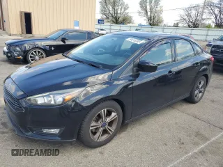 2018 Ford Focus SE with VIN 1FADP3FEXJL215912, listed as a Copart auction lot 50518385 with 100,080 mi miles and Salvage Title. Bid and sale history available at carsss.com. Image 1.