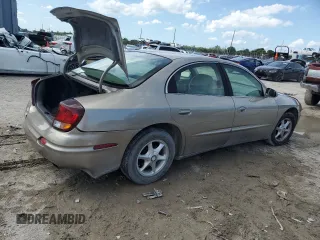 2001 Oldsmobile Aurora z VIN 1G3GR64H914122292, wystawiony jako Copart lot #75867154 z przebiegiem 120 977 mil mil oraz Szkody całkowita. Historia ofert i sprzedaży dostępna na DreamBid. Obrazek 3.