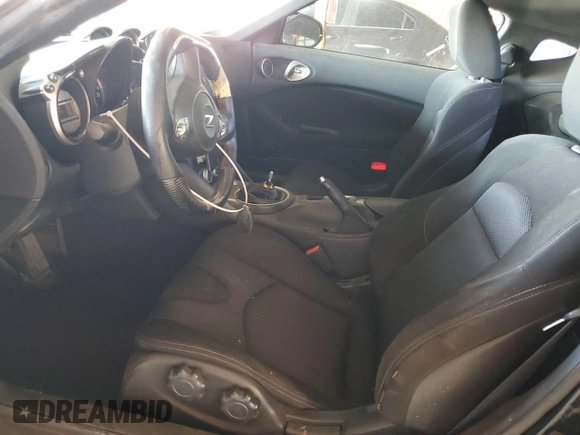2009 Nissan 370Z z VIN JN1AZ44E19M411715, wystawiony jako Copart lot #56654815 z przebiegiem 123 791 mil mil oraz Szkoda całkowita • Salvage title. Historia ofert i sprzedaży dostępna na DreamBid. Obrazek 7.