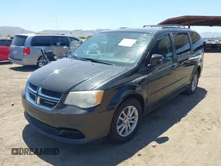 2014 Dodge Grand Caravan SXT with VIN 2C4RDGCG7ER265931, listed as a IAAI auction lot 42141644 with 205,968 mi miles and . Bid and sale history available at DreamBid. Image 6.