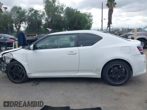 2014 Scion tC with VIN JTKJF5C79E3075707, listed as a IAAI auction lot 41557310 with 132,468 mi miles. Bid and sale history available at carsss.com. Image 15.