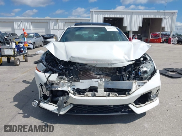 2018 Honda Civic Si with VIN 2HGFC1E53JH700251, listed as a IAAI auction lot 42043732 with 104,763 mi miles and . Bid and sale history available at DreamBid. Image 12.