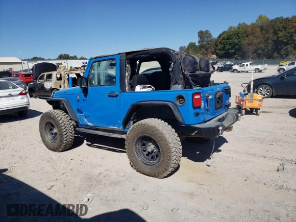 2011 Jeep Wrangler Rubicon with VIN 1J4BA6D15BL563410, listed as a Copart auction lot 76973964 with 68,334 mi miles and Salvage title. Bid and sale history available at DreamBid. Image 2.