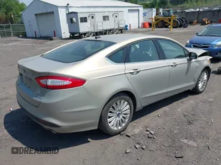 2015 Ford Fusion SE Hybrid z VIN 3FA6P0LU3FR163695, wystawiony jako IAAI lot #42428393 z przebiegiem 237 835 mil mil oraz . Historia ofert i sprzedaży dostępna na DreamBid. Obrazek 4.