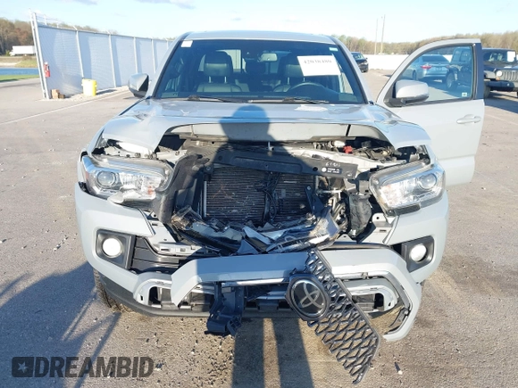 2018 Toyota Tacoma SR5 with VIN 3TMDZ5BN3JM054548, listed as a IAAI auction lot 42038480 with 122,242 mi miles and . Bid and sale history available at DreamBid. Image 6.
