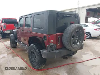 2007 Jeep Wrangler Unlimited Sahara with VIN 1J4GB59197L142223, listed as a IAAI auction lot 42025639 with 155,274 mi miles and . Bid and sale history available at DreamBid. Image 3.